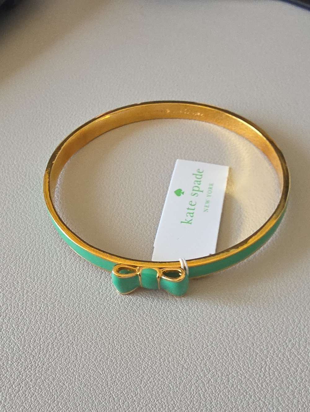 kate spade Gold Plated Bangle with Green Enamel Bow Accent